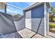 Screened lanai with tiled floors, a white storage closet and vinyl siding at 3300 Loveland Blvd # 2801, Punta Gorda, FL 33980