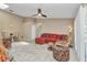 Spacious living room featuring a comfortable red sectional sofa and tile flooring at 3300 Loveland Blvd # 2801, Punta Gorda, FL 33980