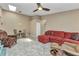 Open-concept living area with tile floors, a skylight, and comfortable seating arrangement at 3300 Loveland Blvd # 2801, Punta Gorda, FL 33980