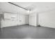 Garage with epoxy flooring and storage space at 3315 Elkcam Blvd, Port Charlotte, FL 33952