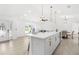 Open kitchen with large island, pendant lighting, and views to the living and dining areas at 3315 Elkcam Blvd, Port Charlotte, FL 33952