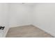 This room features wood-look tile floors, neutral walls and white baseboards at 3315 Elkcam Blvd, Port Charlotte, FL 33952