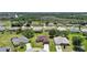 Aerial view showcasing a neighborhood with well-maintained homes and lush greenery at 347 Casale G St, Punta Gorda, FL 33983