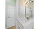 Bright bathroom features a vanity with quartz countertop and modern lighting at 347 Casale G St, Punta Gorda, FL 33983