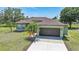Well-maintained single-story home with a two car garage and lush lawn at 347 Casale G St, Punta Gorda, FL 33983