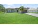 Charming single-story home with well-manicured lawn and lush landscaping at 347 Casale G St, Punta Gorda, FL 33983