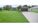 Charming single-Gathering home with a spacious front yard, mature trees, and a long driveway at 347 Casale G St, Punta Gorda, FL 33983