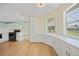 Bright kitchen features white cabinetry and countertops and a breakfast bar at 347 Casale G St, Punta Gorda, FL 33983