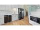 Contemporary kitchen with white cabinets, modern appliances, and sleek countertops at 347 Casale G St, Punta Gorda, FL 33983