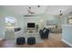 Bright living room featuring vaulted ceilings, ceiling fans, and a view into the dining area at 347 Casale G St, Punta Gorda, FL 33983