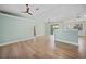 Spacious living room with wood floors, a view of the pool, and easy access to the kitchen at 347 Casale G St, Punta Gorda, FL 33983