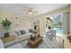 Bright living room with sliding glass doors that overlook the lanai/pool at 347 Casale G St, Punta Gorda, FL 33983
