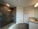 Bathroom featuring a glass-enclosed tiled shower and granite vanity at 411 Paramaribo St, Punta Gorda, FL 33983