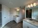 Bathroom with double sinks and vanities plus glass enclosed tiled shower at 411 Paramaribo St, Punta Gorda, FL 33983