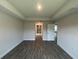 Spacious bedroom with a tray ceiling and wood-look tile flooring at 411 Paramaribo St, Punta Gorda, FL 33983