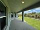 Relaxing covered lanai overlooking the beautiful backyard and waterfront at 411 Paramaribo St, Punta Gorda, FL 33983