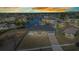 Gorgeous aerial view of a waterfront property with serene canal access and stunning sunset sky at 4213 Gardner Dr, Port Charlotte, FL 33952