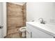 Bright bathroom with modern sink, toilet, and tiled walk-in shower at 4213 Gardner Dr, Port Charlotte, FL 33952