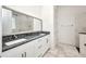 Elegant bathroom with double sinks, granite countertops, and a walk-in shower at 4213 Gardner Dr, Port Charlotte, FL 33952