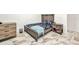 Modern bedroom with a well-crafted wood bedframe and stylish marble-patterned tile flooring at 4213 Gardner Dr, Port Charlotte, FL 33952