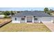 Charming single story home with a brick driveway and well-manicured lawn at 4213 Gardner Dr, Port Charlotte, FL 33952