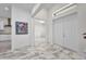 Open foyer with marble floors, offering a view into the living spaces and kitchen at 4213 Gardner Dr, Port Charlotte, FL 33952