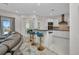Modern kitchen with bar seating, stainless steel appliances, and sleek countertops at 4213 Gardner Dr, Port Charlotte, FL 33952