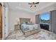 Comfortable main bedroom featuring large windows and marble floors for a luxurious feel at 4213 Gardner Dr, Port Charlotte, FL 33952
