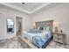 Spacious main bedroom with a tray ceiling, and decorative bedding, with an ensuite bathroom at 4213 Gardner Dr, Port Charlotte, FL 33952