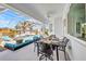 Inviting patio with stylish furniture, fire pit, and views of the sparkling pool and lush landscaping at 4213 Gardner Dr, Port Charlotte, FL 33952