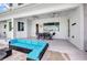 Covered outdoor patio with comfortable seating, ceiling fans, and stylish decor for relaxing and entertaining at 4213 Gardner Dr, Port Charlotte, FL 33952