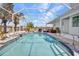 Relaxing pool with screened enclosure and beautiful backyard landscaping at 4213 Gardner Dr, Port Charlotte, FL 33952