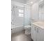 Bathroom with a shower/tub combo and grey tile floors at 5800 Sabal Trace Dr # 1302, North Port, FL 34287