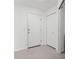 Entryway with grey tile floors and a closet and door at 5800 Sabal Trace Dr # 1302, North Port, FL 34287
