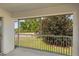 View from the screened porch showing lush landscaping at 5800 Sabal Trace Dr # 1302, North Port, FL 34287