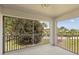 View from the screened porch showing manicured landscaping and a community at 5800 Sabal Trace Dr # 1302, North Port, FL 34287