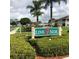 Community sign for Link Side with lush landscaping surrounding the entrance at 5800 Sabal Trace Dr # 1302, North Port, FL 34287