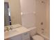 Bathroom featuring a vanity with modern faucet, shower and tub at 582 Reading Nw St, Port Charlotte, FL 33952