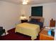 Calm bedroom with neutral walls, carpet, and natural light from the window at 582 Reading Nw St, Port Charlotte, FL 33952