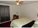 Cozy bedroom featuring a ceiling fan and neutral walls at 582 Reading Nw St, Port Charlotte, FL 33952