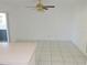 Dining area with tile flooring and sliding glass door access to patio, with an overhead fan for comfort at 582 Reading Nw St, Port Charlotte, FL 33952