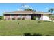 Charming single-story home with a well-maintained lawn and a clean, inviting exterior at 582 Reading Nw St, Port Charlotte, FL 33952