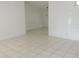 Bright living room with tile floors, neutral walls, and ample space for furnishing at 582 Reading Nw St, Port Charlotte, FL 33952