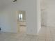 Open-concept living room with tile flooring leading to the kitchen at 582 Reading Nw St, Port Charlotte, FL 33952