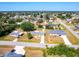 Aerial view of neighborhood and home featuring a large yard, mature trees at 582 Ridgewood Nw St, Port Charlotte, FL 33952