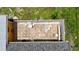 An aerial view of the backyard patio with outdoor seating and an enclosed privacy fence at 582 Ridgewood Nw St, Port Charlotte, FL 33952