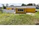 View of the home's backyard, featuring a privacy-fenced patio area and a storage shed at 582 Ridgewood Nw St, Port Charlotte, FL 33952