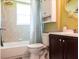 Bathroom with a bathtub, shower and toilet at 582 Ridgewood Nw St, Port Charlotte, FL 33952