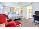 A bright bedroom with an adjacent bathroom, perfect for relaxation and convenience at 582 Ridgewood Nw St, Port Charlotte, FL 33952