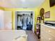Bedroom walk-in closet with organized shelving, clothing rack, and a mirrored door at 582 Ridgewood Nw St, Port Charlotte, FL 33952